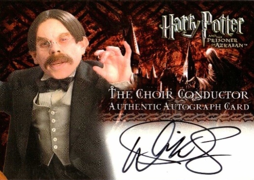 Warwick Davis as The Choir Conductor