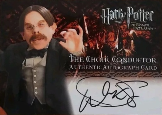 Warwick Davis as The Choir Conductor - Front