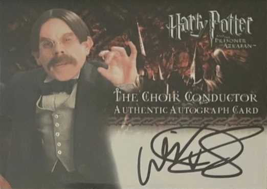 Warwick Davis as The Choir Conductor - Front